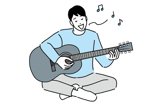 ギター引きながら歌う男性